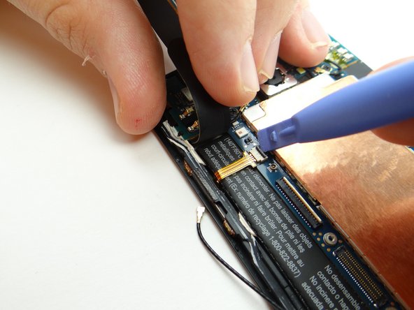 Open volume rocker cable ZIF connector.