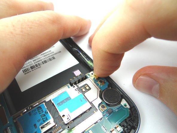 Use your index finger to reattach the wifi antenna cable.