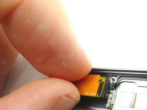 Gently peel the antenna up from its foam adhesive backing.  Place in COMPARTMENT F.