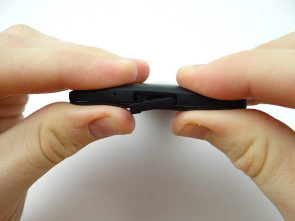 Picture 3: Squeeze bottom of battery cover into place.