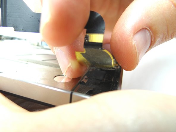 Use your fingers to remove the charging port once it's loose.  Place charging port in ZONE IV.