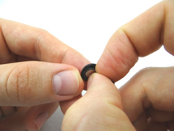 Carefully guide the ribbon cable through the mid-frame.