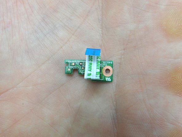 Peel up power button cable with your fingers and place in COMPARTMENT B.