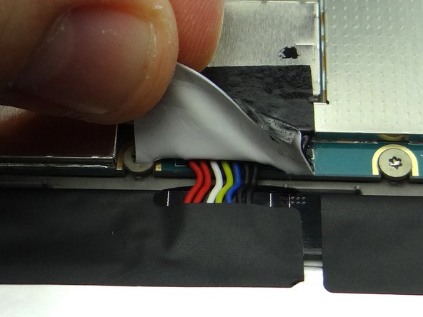 Fold down tape to cover the battery connector.