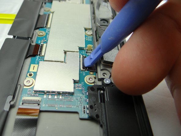 Picture 2: Use the blue pry tool to open rear camera ZIF connector.