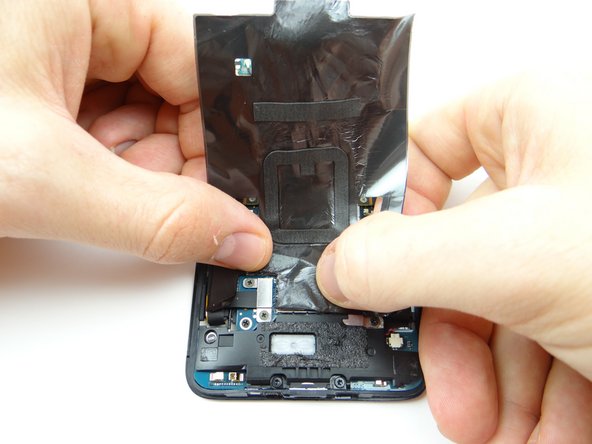 Gently peel it away from the phone.