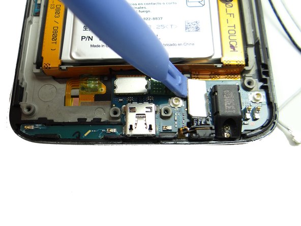 Pictures 1 &amp; 2: Use the blue pry tool to disconnect two display cable connectors.