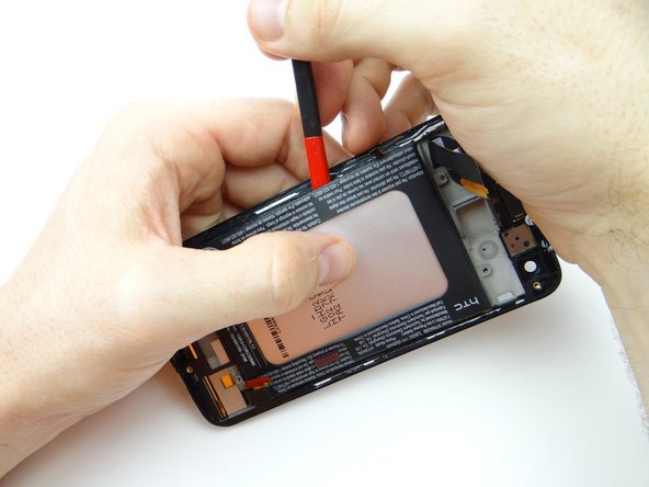 Picture 3: Carefully peel the battery up from the top with your fingers.