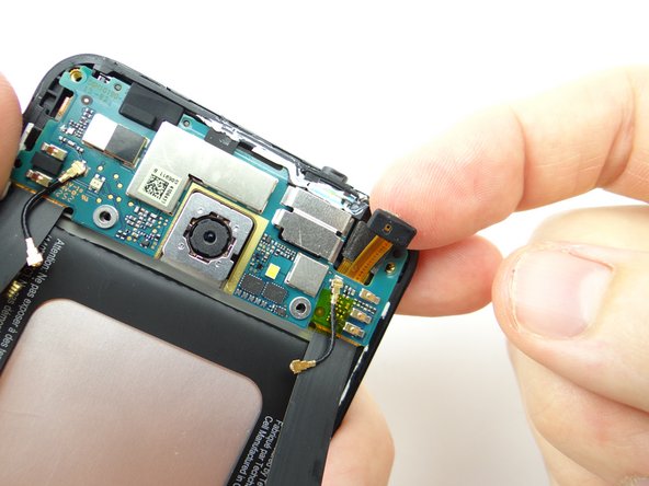 Dislodge microphone, but don't try to remove it.