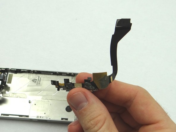 Use your fingers to remove the charging port once it's loose. Place charging port in ZONE IV.