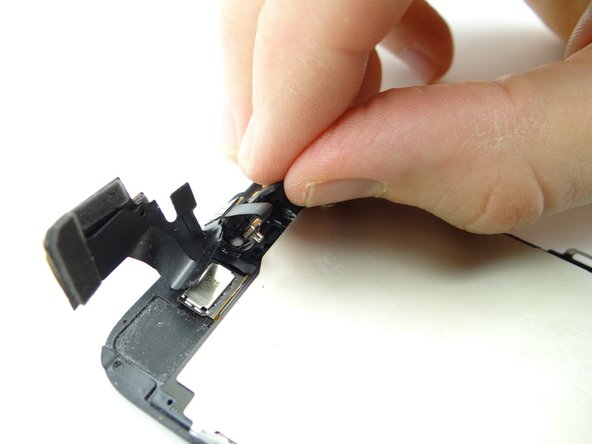 Peel up front-facing camera and microphone assembly with your fingers.