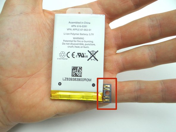 Work the battery up without warping the battery or damaging the connector.