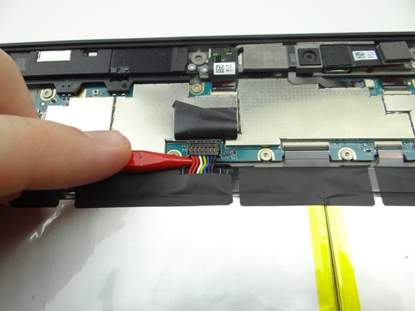Work slowly and carefully as you pry up the battery connector: