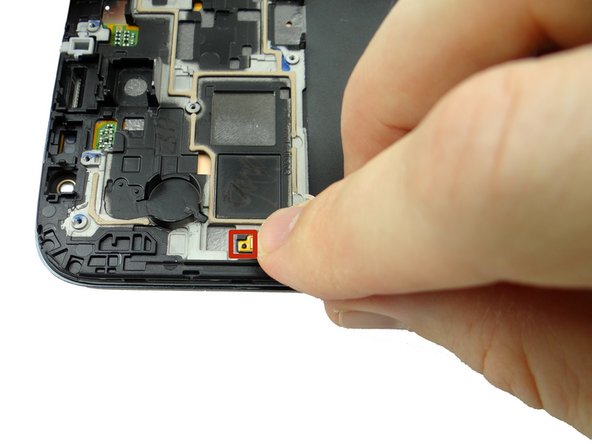 Seat the opening on the cable over the tab on the front panel.