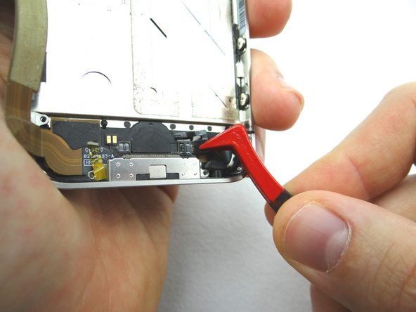 Picture 2: Use Plastic Tweezers to pull the home button ribbon cable just free from the ZIF connector.