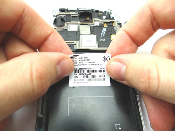 Place the IMEI sticker on the new display assembly and smooth out with your fingers.