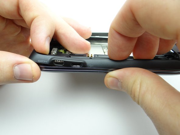 Seat the HDMI and charging ports first, then continue snapping rear frame into place.