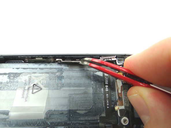 Picture 2: Use Curved Tip Tweezers to move the volume buttons out of position.