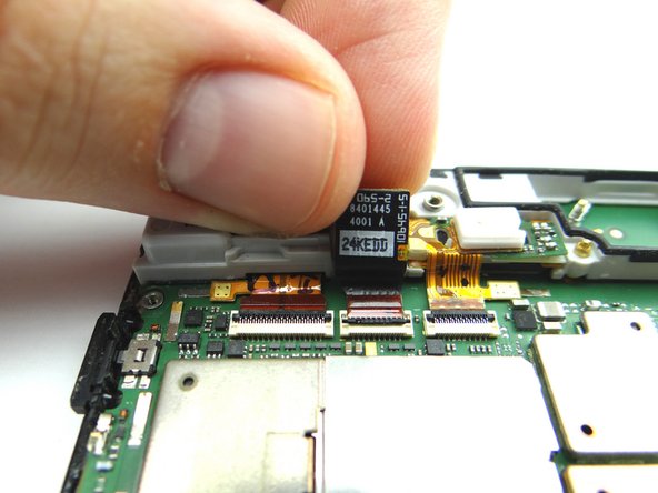 Picture 1: Replace front-facing camera from COMPARTMENT D.  Push the cable into the connector first, then seat the camera in its socket.