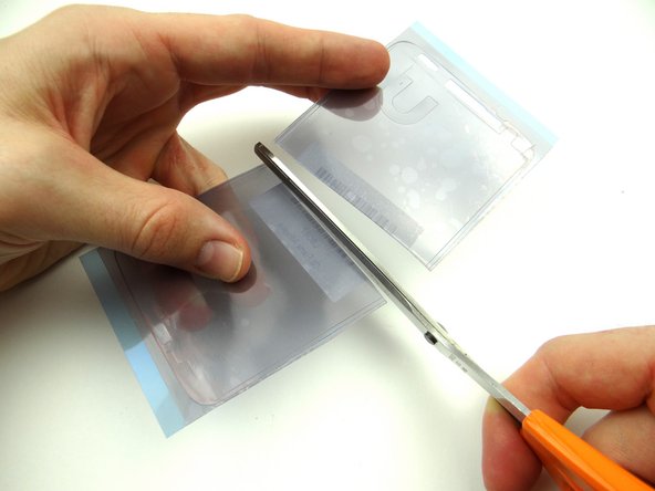 Retrieve the mid-frame from ZONE V, the mid-frame adhesive and scissors: