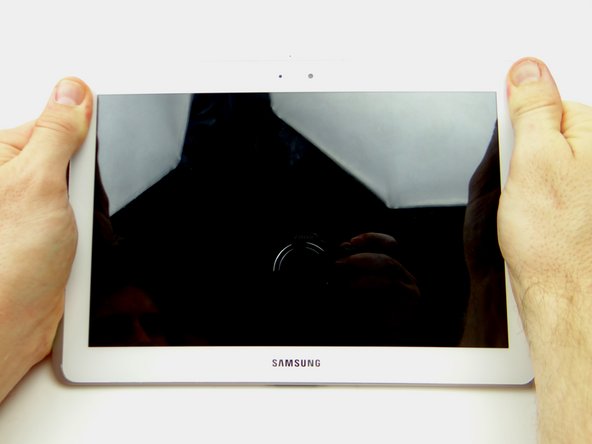 Picture 2: Press clips in top corner into place.