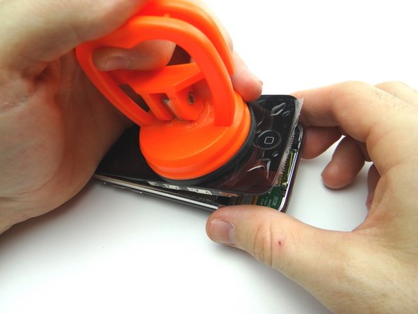 Picture 3: Pry up just enough to grab the screen with your fingers. Remove the suction cup.