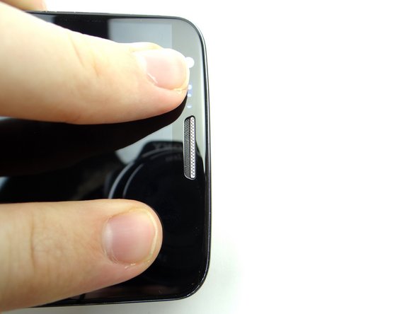 Push the top edge firmly into place. Repeat along the bottom.