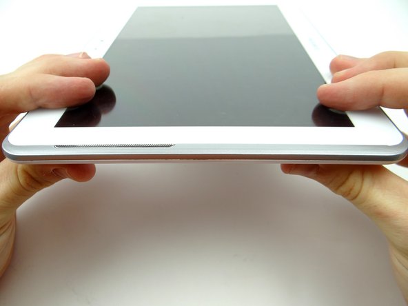 Examine all edges to ensure all clips are seated and the display is flush with the rear case.