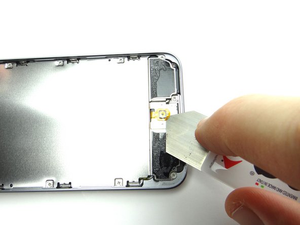 Picture 3: If you can't wedge the spudger under the home button contact, use your fingernail or iSesamo to get it started.