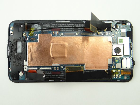 Make sure no cables are trapped underneath as you finish seating the logic board.