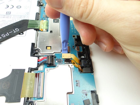 Use blue pry tool to disconnect rear camera.