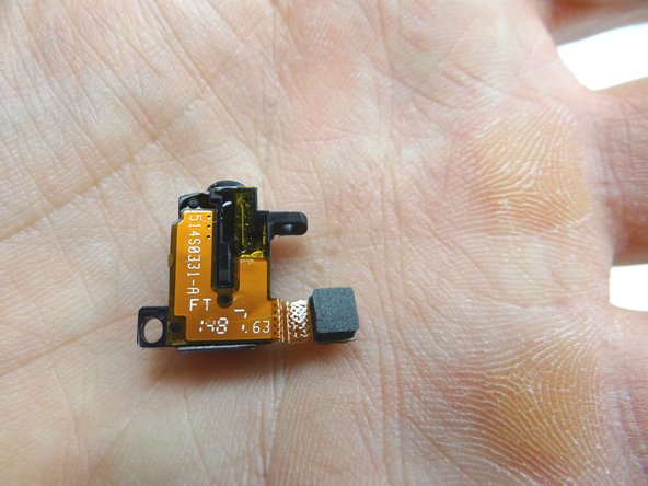 From COMPARTMENT C, use your fingers to seat the headphone jack.