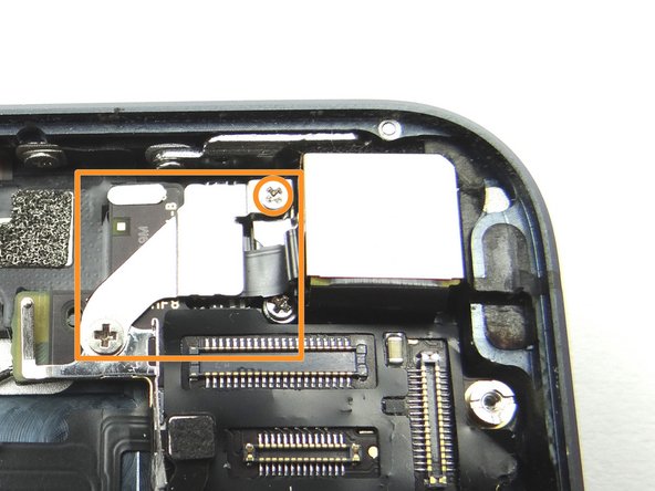 Picture 3: Remove one 1.5 mm Phillips screw and place in SLOT 10.  Next, remove the shield and place in SLOT 10 with the Phillips screw.
