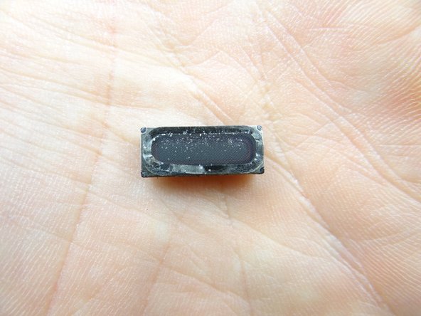 If you're replacing the earpiece speaker, just yank it up by the metal contacts on either side.