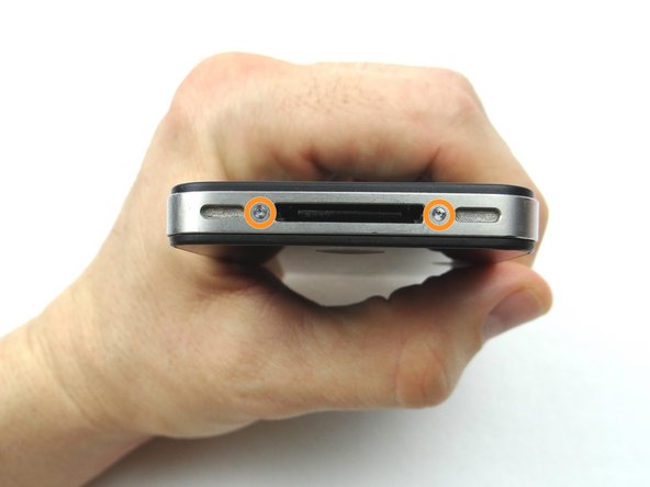 Picture 2: Place the handset in your non-dominant hand, then replace two Pentalobe screws near charging port with special 5-point Pentalobe screwdriver. The screws are in SLOT 1.