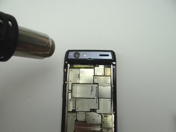 If the trim is loose, try heating the area to reactivate the adhesive.  Apply pressure until the trim is secure.  (If necessary, apply thin strips of double-sided adhesive to secure the trim.)