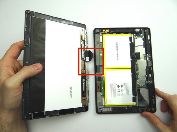 Bring the display assembly to the rear case to attach the two display cables.