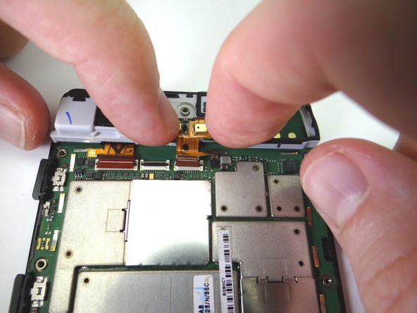 Picture 2: Seat the assembly on the antenna bracket.