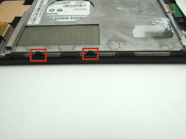 Make sure the mid-plate is seated under the clips on the front panel.