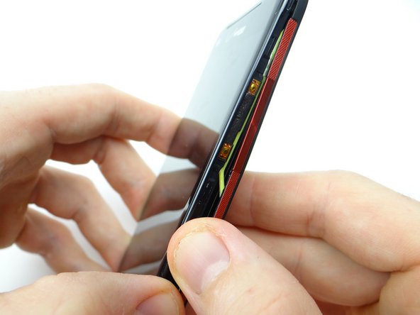 Pictures 2 &amp; 3: The neon gasket should stay attached to the battery cover.  If the gasket sticks to the front panel, use the pointed end of the spudger to free it.