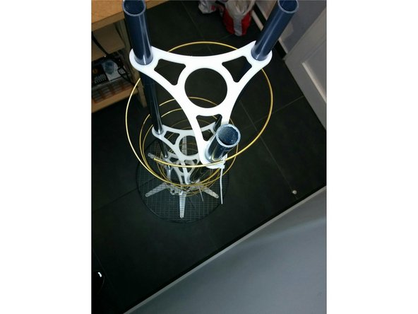 Position the helicoid around the three PVC pipes clockwise or counterclockwise depending on the antenna you want to build, (RHCP or LHCP). On the picture provided  it’s an LHCP antenna.