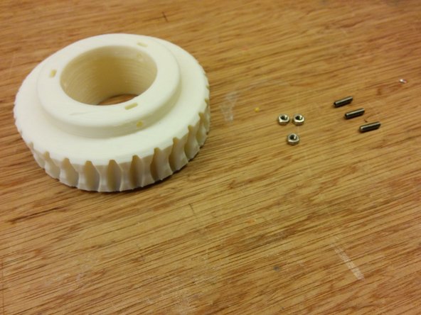 Insert the M3 nuts to axis gear part.