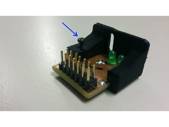 Slide The pcb into the 3D printed part and use the M2 screw to gently hold it in place