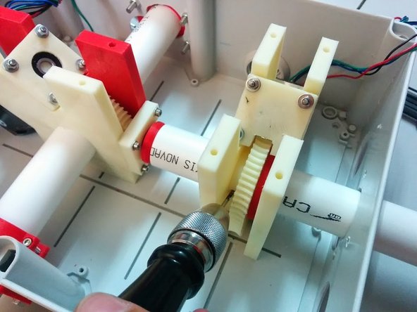 Slide the axis tube with the pillar all the way up and hold it firmly in place. Mark a whole in the tube for the Axis gear holding bolt.