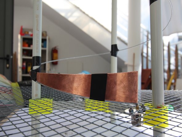 Using sand paper, scrap off the galvanized coating of the wire. This will make soldering possible.