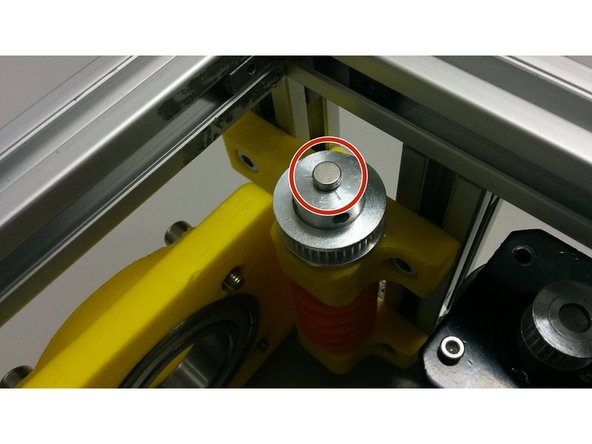 Using some cyanoacrylate glue, fix the magnet over the center of the pulley that is over the worm gear