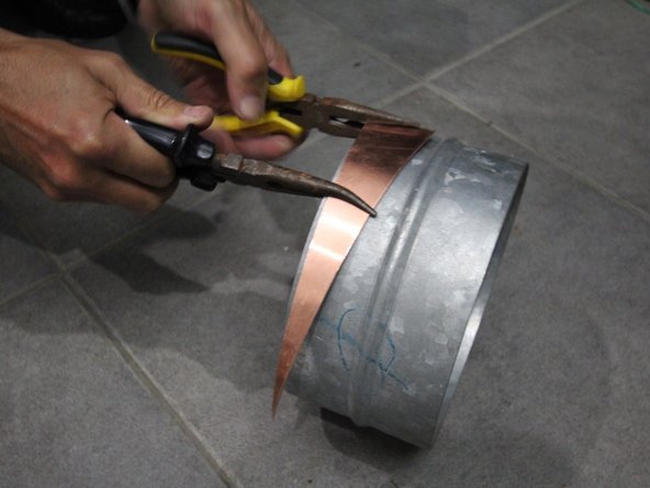 Bend the brass triangle (see bom) using the metal cylinder as a guide. Make sure it is bended on the right direction.