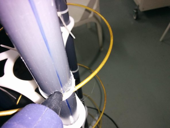 Using hot glue, attach the helicoid to the PVC pipes on the cavities we created using the file in a previous step . Leave it to dry up and get rigid.