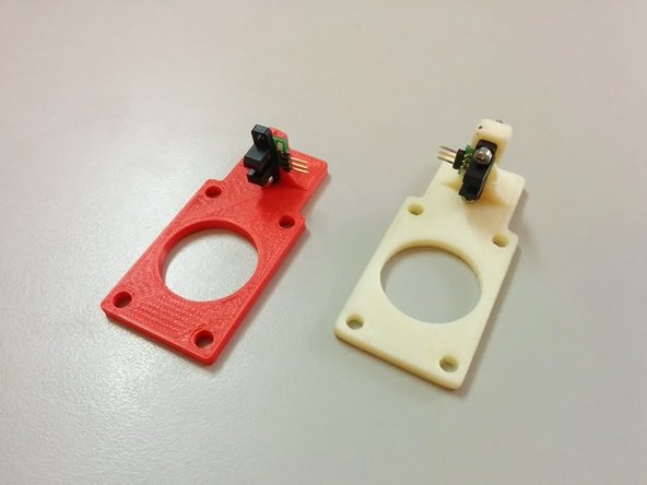 Secure the opto-endstops with the M3 bolts as shown on the homing sensor holder.