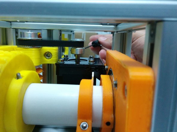 Align the height of the pulleys and secure the pulleys on the axis.